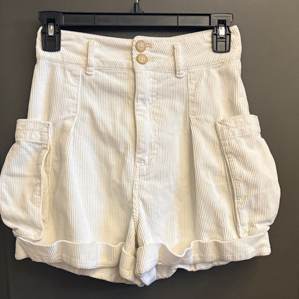 Free People white corduroy cuffed pleated cargo shorts.